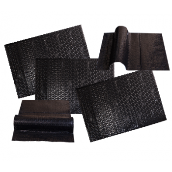 Several pieces of textured, black material lie arranged on a white background, some laying flat while others are partially folded, showcasing their flexibility and distinct surface patterns.