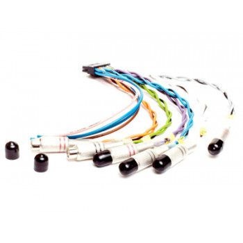 A set of multi-colored wires with metal connectors and black caps, laid out on a white surface. Two loose black caps are positioned nearby.