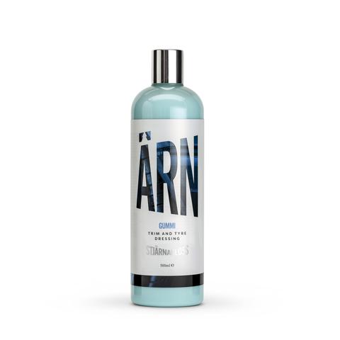 A blue and white bottle labeled "ÄRN Gummi Trim and Tyre Dressing, Stjärnagloss, 500ml" stands upright on a plain, white background, featuring a metallic silver cap.