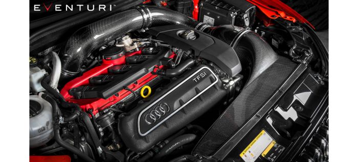 Engine with "TFSI" and Audi logo, enhanced with carbon fiber parts, “EVENTURI” text at the top left corner; displayed in a high-performance vehicle under a lifted hood.