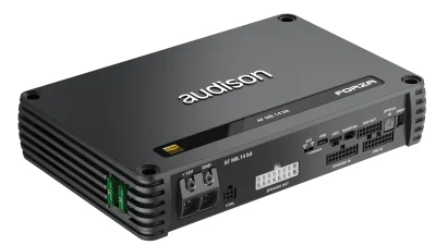 A rectangular gray Audison amplifier labeled "FORZA" has multiple connectors, ports, and labels on one side, placed on a white background with green fuses visible on the side.