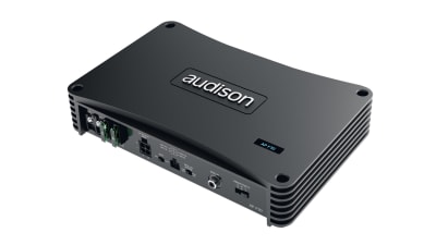 A black audio amplifier labeled "Audison AP1 D" has various input/output ports on one side and is placed against a white backdrop.