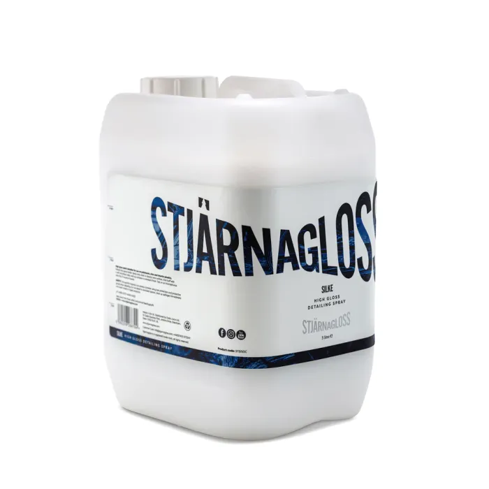 White plastic container labeled "STJÄRNAGLOSS SILKE HIGH GLOSS DETAILING SPRAY" with a blue patterned design, brand logo, barcode, social media icons, and product information text, against a white background.