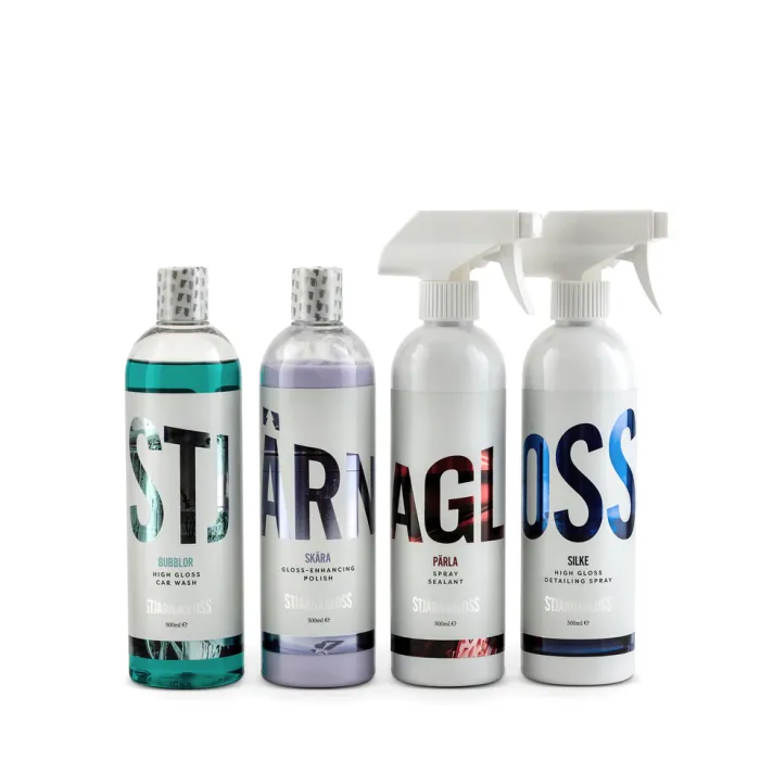 Four bottles containing car cleaning products are lined up; two have silver caps, and two have white spray nozzles. Text on bottles: “BUBBLOR High Gloss Car Wash,” “SKÄRA Gloss-Enhancing Polish,” “PÄRLA Spray Sealant,” and “SILKE High Gloss Detailing Spray.”