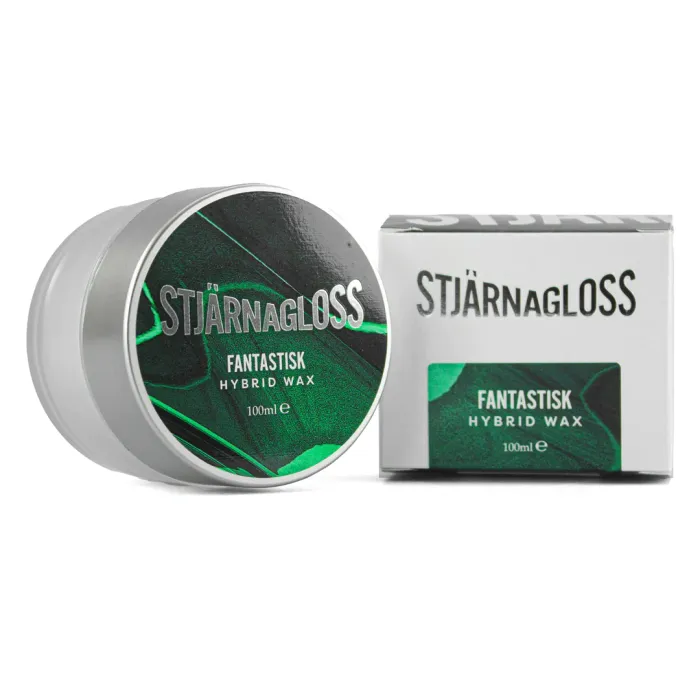 A round metal container labeled "STJÄRNAGLOSS FANTASTISK HYBRID WAX 100ml e" is placed next to a matching product box with similar text and green graphic design.