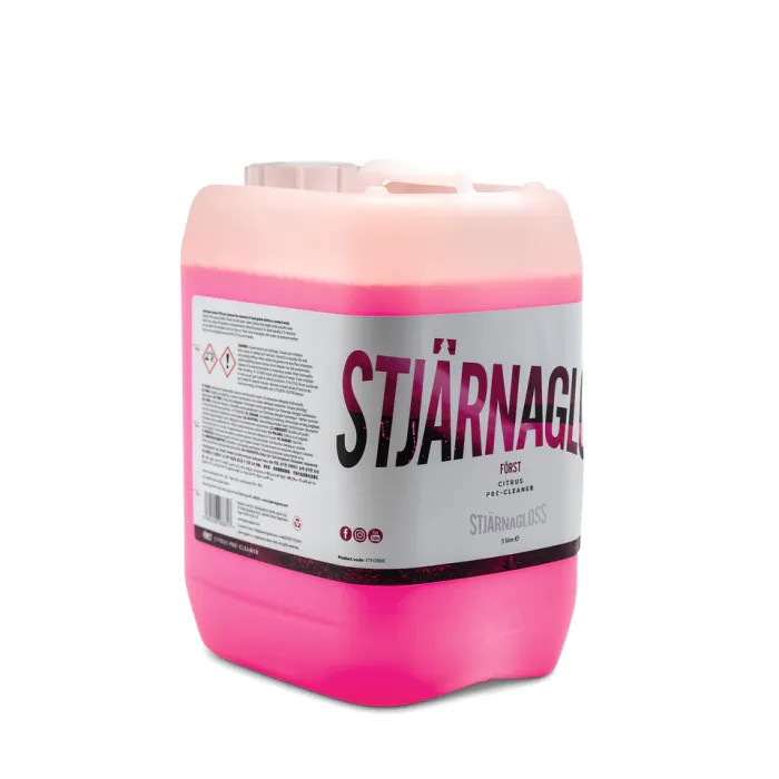 A pink container with a white label reads "STJÄRNAGLOSS FÖRST CITRUS PRE-CLEANER." The container is industrial and placed against a white background. The label includes small text and hazard symbols.