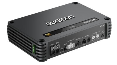 A black Audison car amplifier labeled "FORZA," features multiple input and output ports on one side; context includes close-up view highlighting its sleek design.