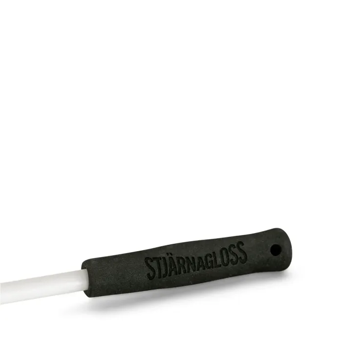 A black handle with the text "STJÄRNAGLOSS" is attached to a white cylindrical rod, positioned on a plain white background.
