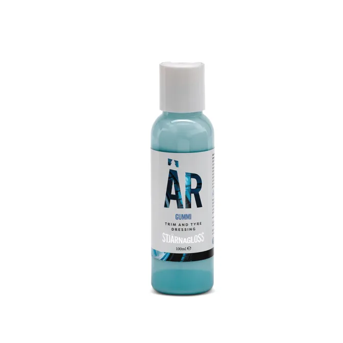 A blue bottle with a white cap labeled "ÄR Gummi Trim and Tyre Dressing STJÄRNAGLOSS 100ml" stands against a plain white background.