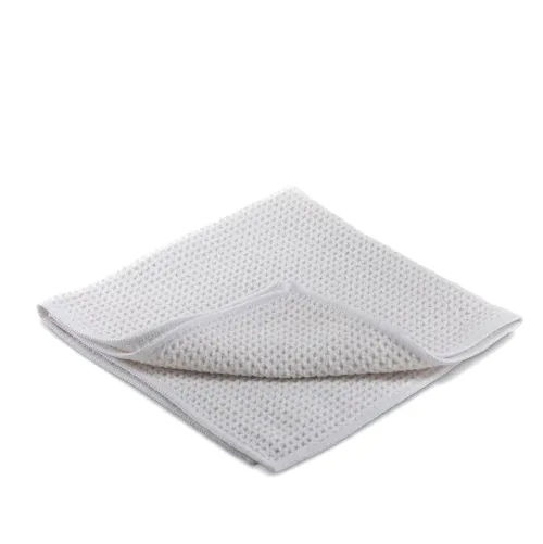 A white, textured microfiber cloth is slightly folded and placed against a plain white background.