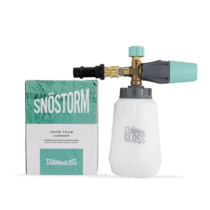 A Stjärnagloss Snöstorm snow foam cannon sits next to its packaging box. The bottle is white with a turquoise lid, and the box displays text: "SNÖSTORM," "SNOW FOAM CANNON," and "STJÄRNAGLOSS."