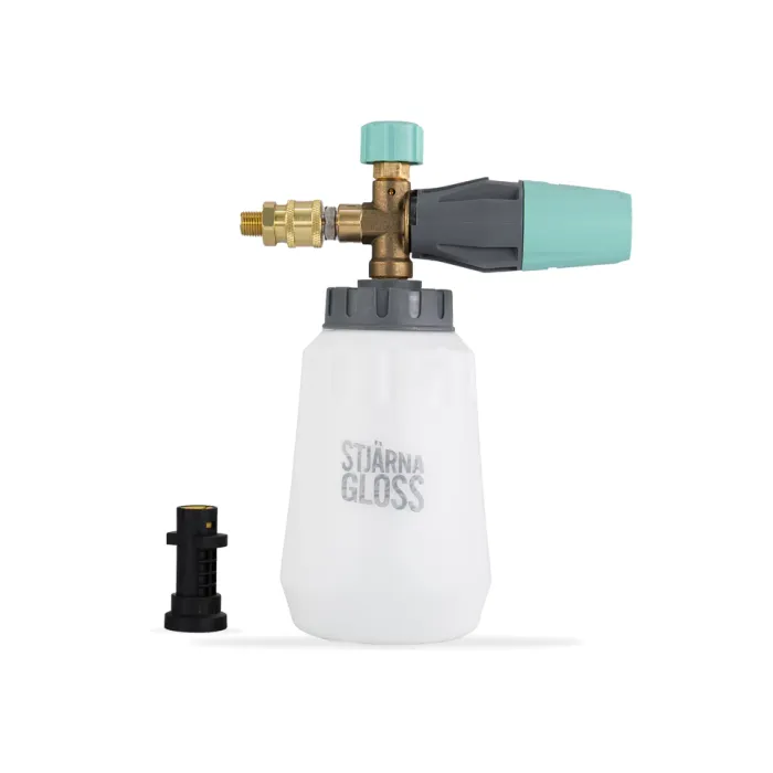 A white foam cannon labeled "STJÄRNA GLOSS" has a brass and plastic nozzle attached; a smaller black attachment lies next to it, all set against a plain white background.