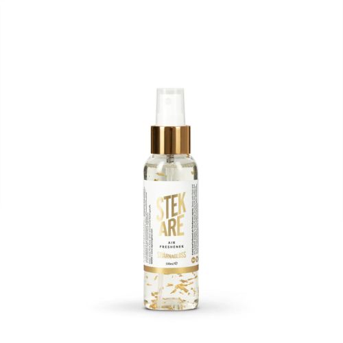 Clear spray bottle labeled "STEKARE AIR FRESHENER STARNA GLOSS 100 ml," with a gold cap and scattered gold flakes inside, situated against a plain white background.