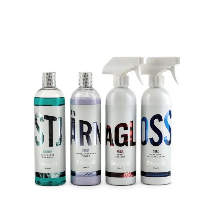 Four bottles of car care products stand in a row. Text on bottles: "Bubblor High Gloss Car Wash," "Skära Gloss-Enhancing Polish," "Pärla Spray Sealant," and "Silke High Gloss Detailing Spray," brand "STJÄRNAGLOSS", 500ml.