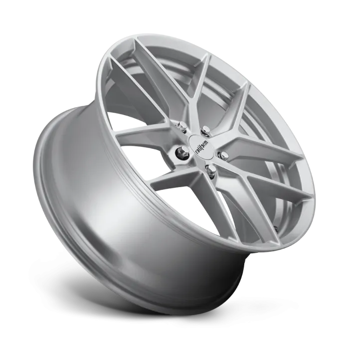 A silver alloy wheel is angled vertically with prominent multi-spoke design. The hubcap center features the text, “oldandm." The surrounding environment is a plain, light background.