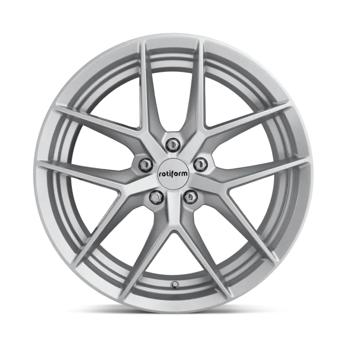 A silver alloy wheel with a multi-spoke design is displayed against a white background. The center cap features the text "rotiform."