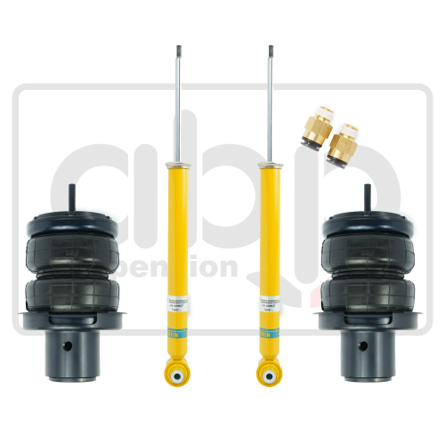 Automobile suspension components; two yellow shock absorbers with metal rods, two black air springs, and two brass fittings; arranged on a white background with a partial logo reading "aib suspension."