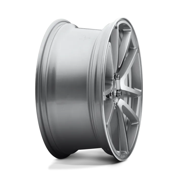 A metallic silver alloy wheel rim is displayed on a plain white background, showcasing its six V-shaped spokes and smooth, reflective surface.