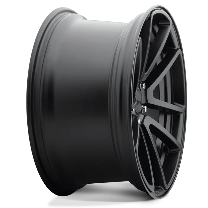 A black, multi-spoke car wheel rim is shown in close-up, highlighting its sleek design and smooth finish; positioned against a plain, light background.