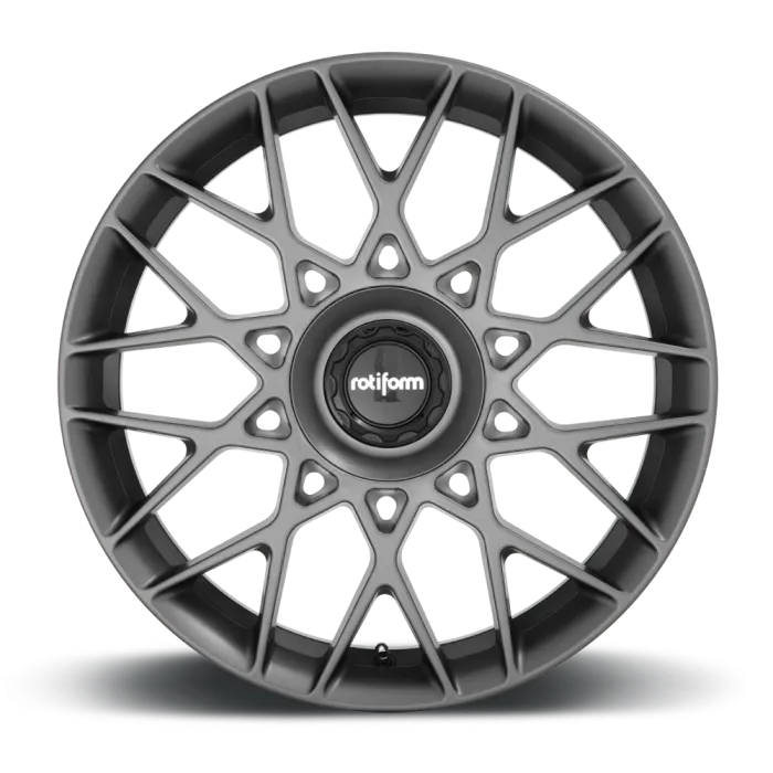 Gray alloy wheel with intricate, multi-spoke design, displaying the brand name "rotiform" at its center in a high-resolution, studio background.