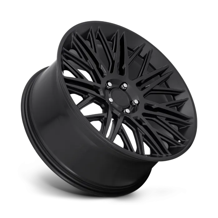 A matte black car wheel displayed on a white gradient background, featuring intricate, angular spoke designs radiating from the center hub.