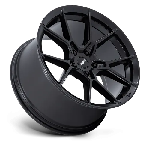 A black alloy car wheel displayed against a plain background, featuring a multi-spoke design with the word “rotiform” on the center cap and spokes.