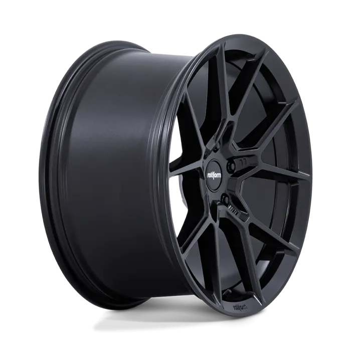 A matte black alloy car wheel with a multi-spoke design, standing against a plain, black background. Central hub features the text "rotiform."
