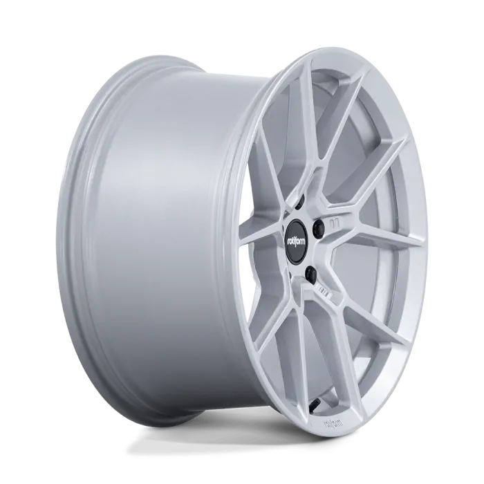 A metallic silver car wheel features a multi-spoke design with a central black hub cap displaying the text "rotiform," isolated on a white background.
