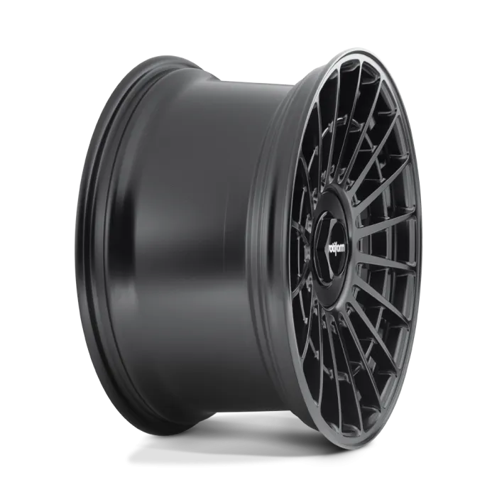 A matte black alloy wheel with a multi-spoke design stands upright, displaying a "rotiform" logo at its center, set against a white background.
