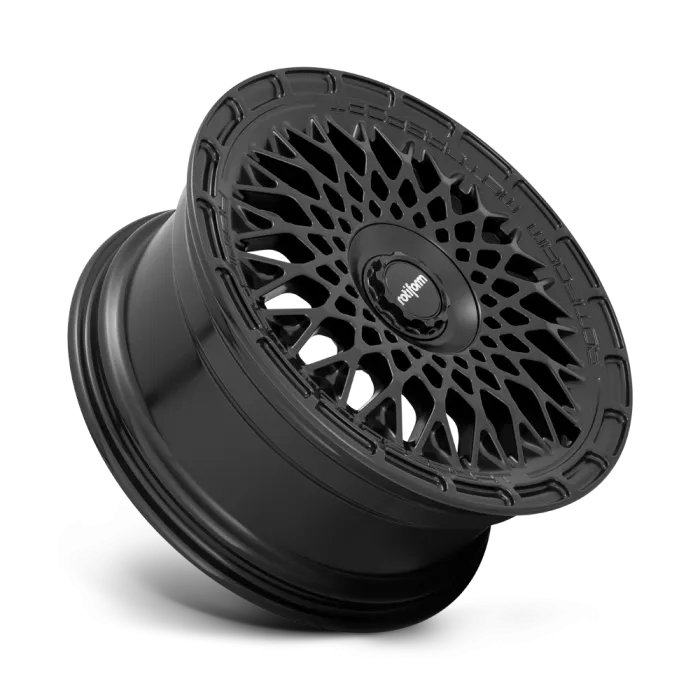 A black mesh-style alloy wheel with intricate, web-like spoke design against a plain background. Text on the wheel's center reads "rotiform."