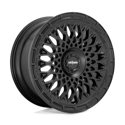 A black, intricately designed Rotiform car wheel rests alone against a plain, light-gray background. Text on the central hub reads "rotiform," while the rim is inscribed with "ROTIFORM MOTORSPORT."