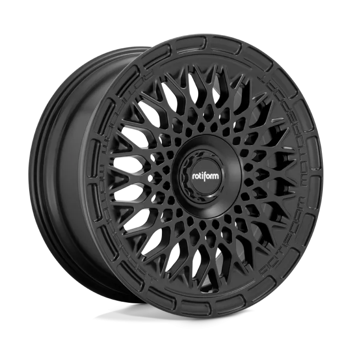 A black, intricately designed Rotiform car wheel rests alone against a plain, light-gray background. Text on the central hub reads "rotiform," while the rim is inscribed with "ROTIFORM MOTORSPORT."