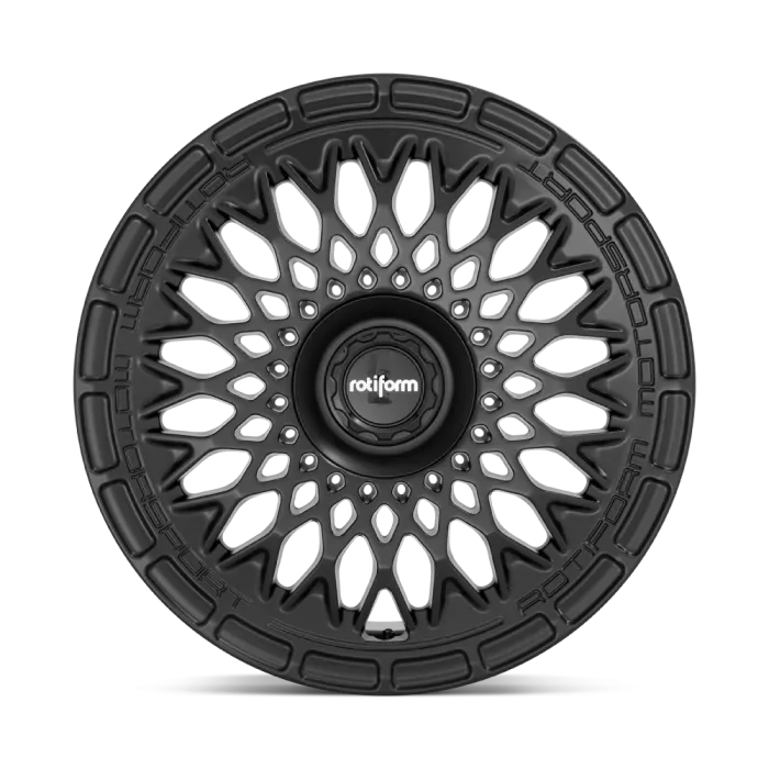 Black, intricately designed alloy wheel with a central hub labeled "rotiform," displaying a pattern of interwoven spokes; background is plain and gradient gray.