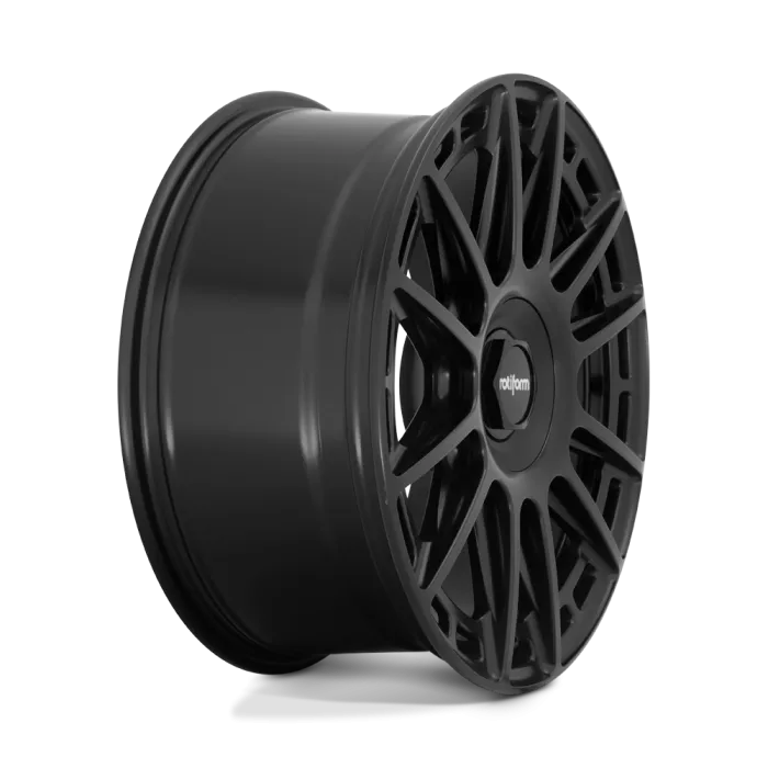 A black, multi-spoke alloy wheel with the brand name "rotiform" in the center cap, shown against a white and gradient blue background.
