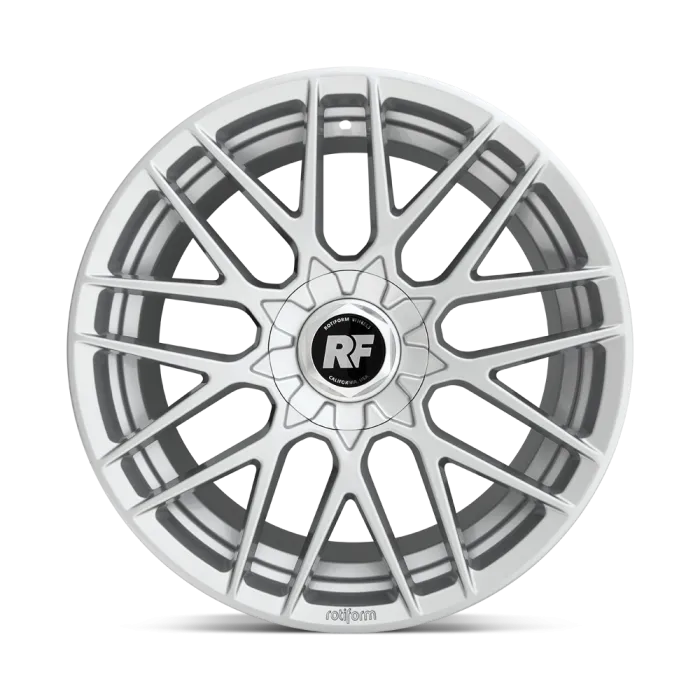 A silver alloy wheel with a multi-spoke design is displayed on a clean, white background. The center cap features the text "ROTIFORM WHEELS" and "RF." The bottom edge reads "rotiform."