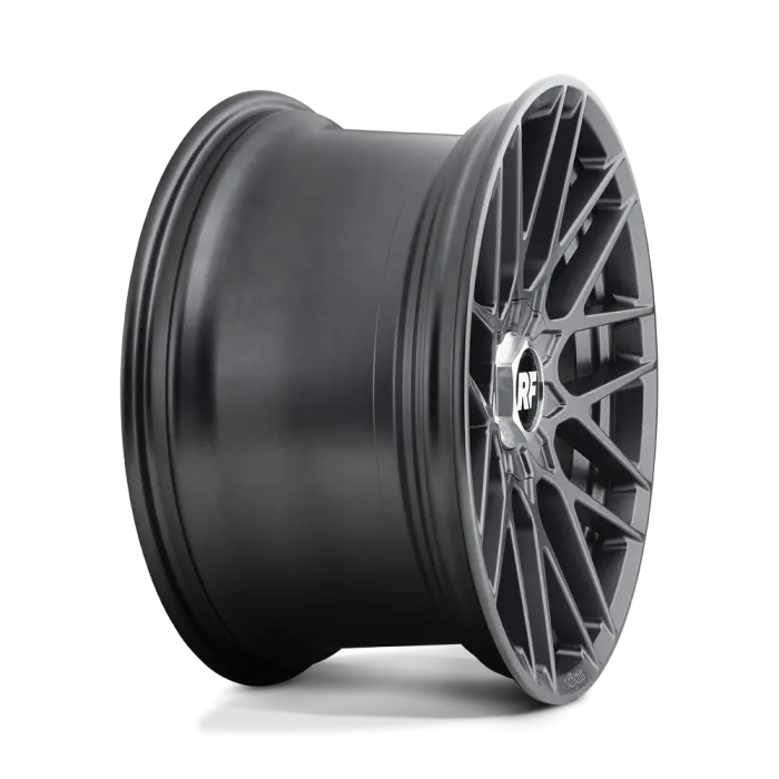A metallic black car wheel rim with intricate spoke design displaying "RF" in the center, photographed against a plain white background.