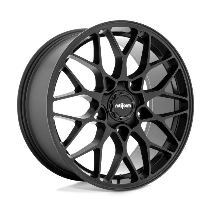 A matte black alloy wheel featuring an intricate multi-spoke design, angled slightly, with "rotiform" text on the central hub, displayed against a neutral, grey backdrop.