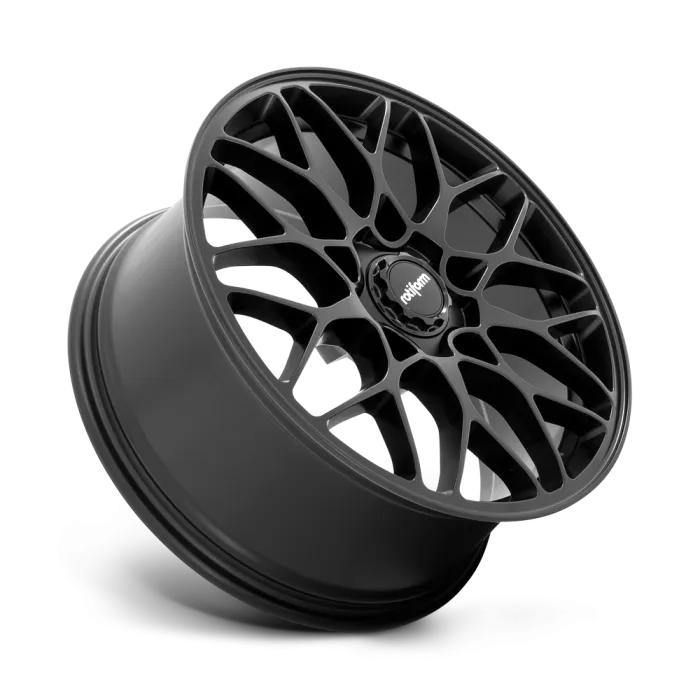 A black, intricate, multi-spoke alloy wheel with the brand "rotiform" on the central hub, isolated on a white background.
