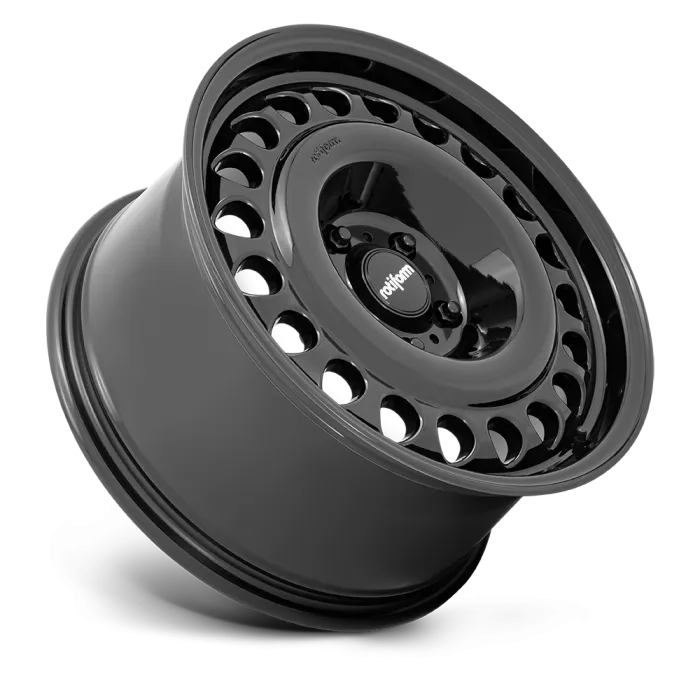 A shiny black alloy wheel with multiple circular holes around the edge and the word "rotiform" written on the center cap, displayed against a plain gray background.