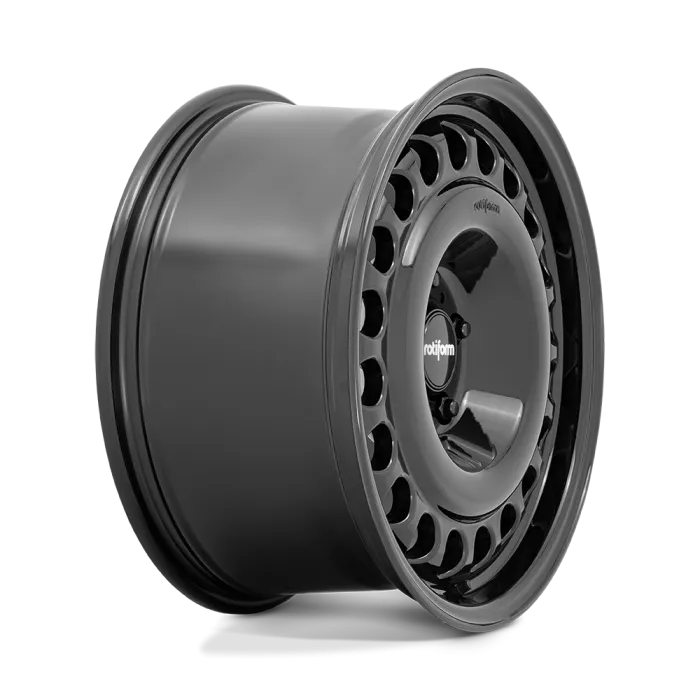 A dark gray car wheel rim with a circular pattern of oval cutouts, showcasing the "rotiform" logo at its center. The rim is positioned against a white background.