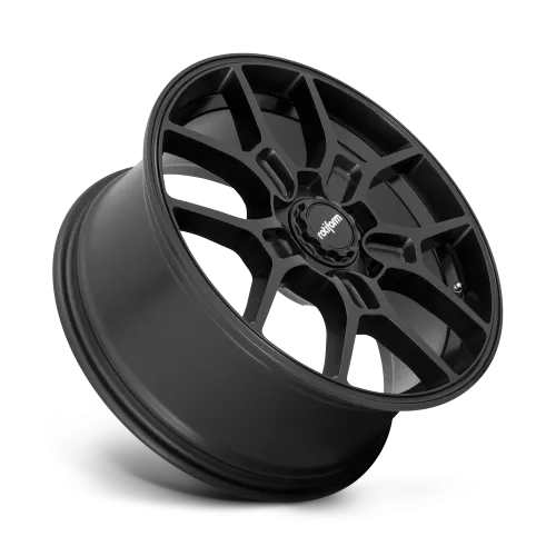 A black, multi-spoke car wheel rim is angled with the "rotiform" logo at the center. The background is a gradient of gray, highlighting the metallic finish.