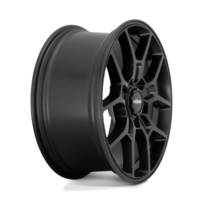 A matte black alloy wheel with multiple spokes bears the logo "rotiform" at its center, positioned against a solid white backdrop.