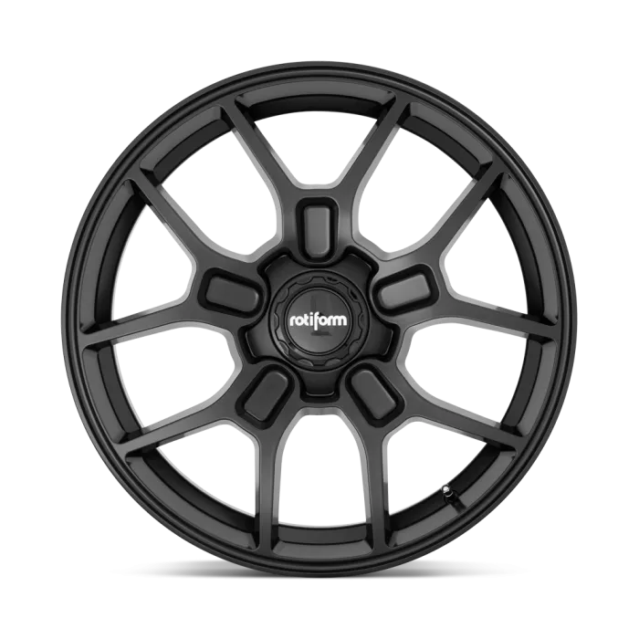 A black alloy wheel with a multi-spoke design, featuring a central hubcap labeled "rotiform," displayed against a solid white background.