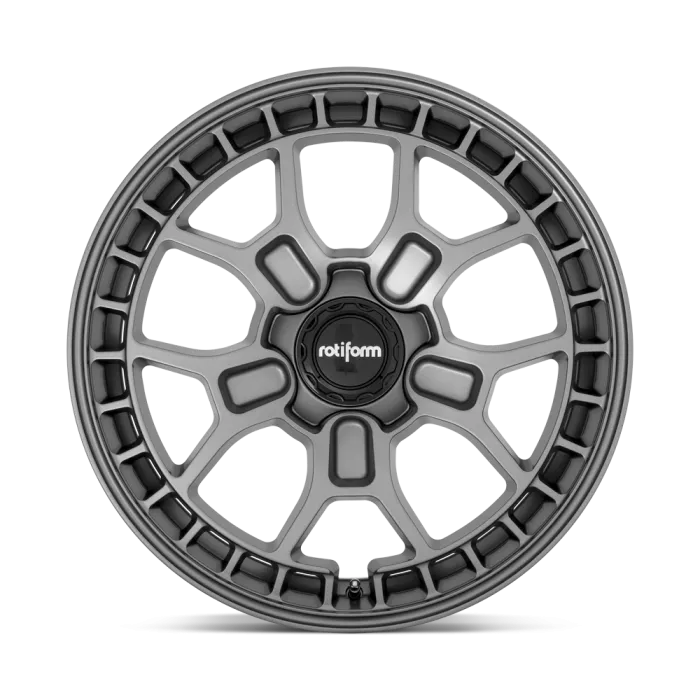 A grey alloy wheel with a multi-spoke, web-like design featuring "rotiform" on the central hub, set against a plain background.