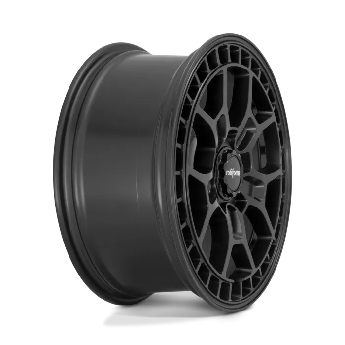 A black Rotiform wheel rim features a multifaceted, angular spoke design. The word "rotiform" is printed at the wheel's center cap, presented against a white background.