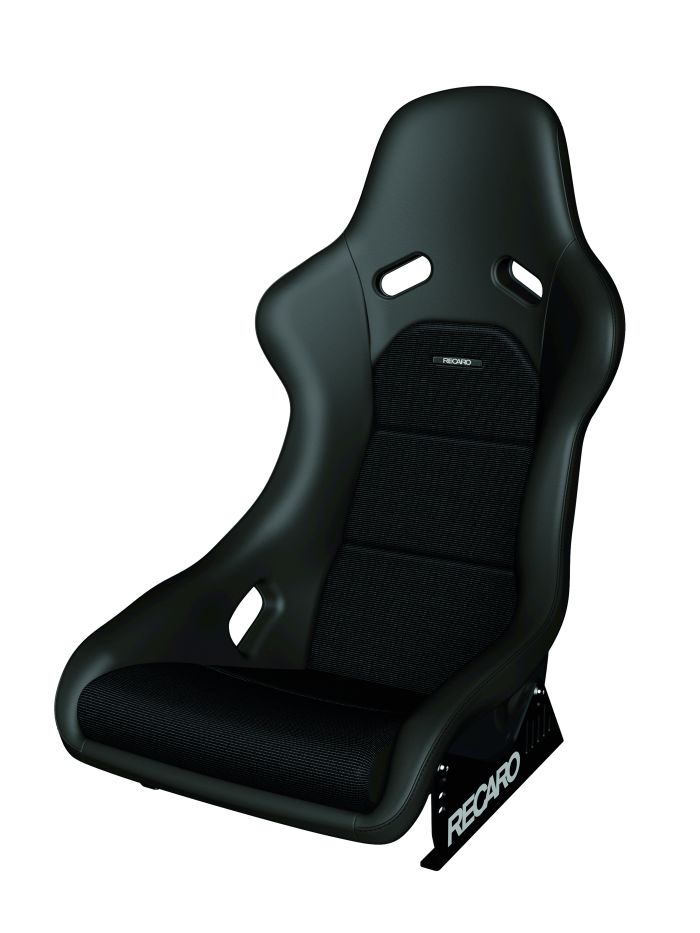 A black Recaro racing seat with side bolsters and a reclined position, displaying the "RECARO" logo on its side support, isolated against a white background.