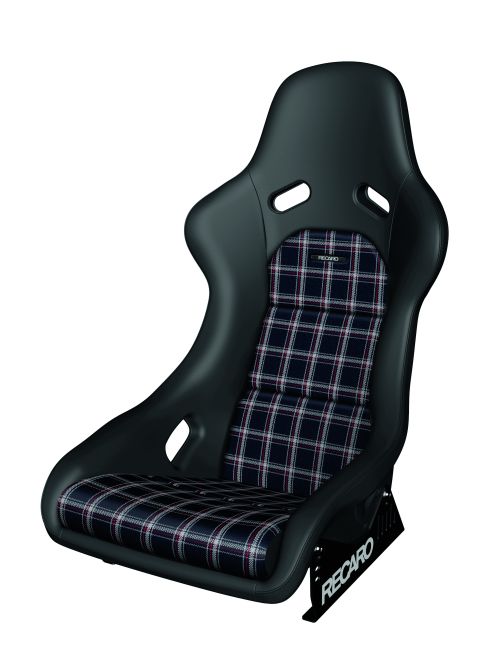 A black racing car seat with plaid fabric inserts, featuring cutouts for harness belts. The seat has the brand name "RECARO" on its metal base.