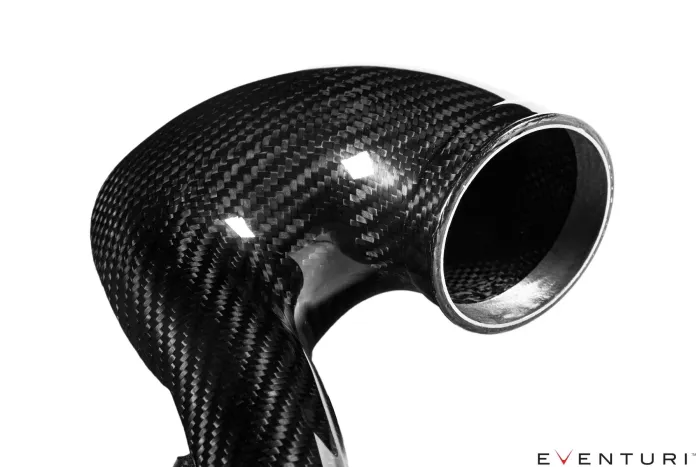 A shiny, black carbon fiber automotive intake pipe with a smooth, curved design against a white background; the bottom right corner has the text "EVENTURI™".