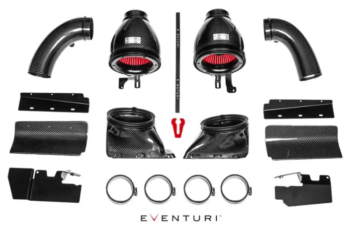 Car air intake system parts, including carbon fiber tubes, air filters, clamps, and mounting brackets, arranged symmetrically on a white background. Text: "EVENTURI" at the bottom center.