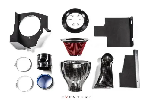 Various car engine parts arranged on a white background, including a red air filter, carbon fiber intake components, metal brackets, clamps, and a blue-tinted cover. Text: "EVENTURI".